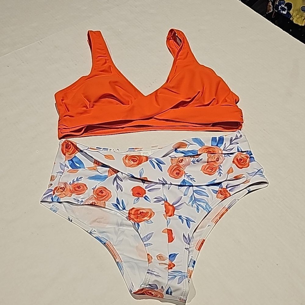Two piece swimsuit features high waisted floral bottom